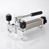 Compact 2 kg vacuum and pressure calibration pump with 330×205×150 mm size for easy carrying
