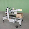 Industrial carton sealing machine with automatic top flap folding system
