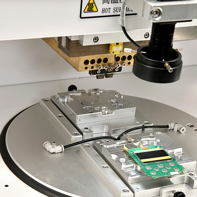 Front view of XONJE XJPP-2F floor turntable pulse welding machine with dual rotary workstations and CNC temperature control