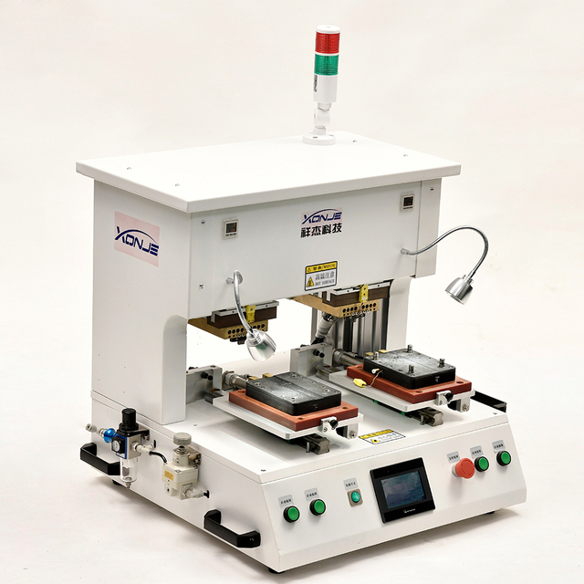 Front view of XONJE XJPP-3A double head pulse welding machine with dual workstation layout and CNC temperature control