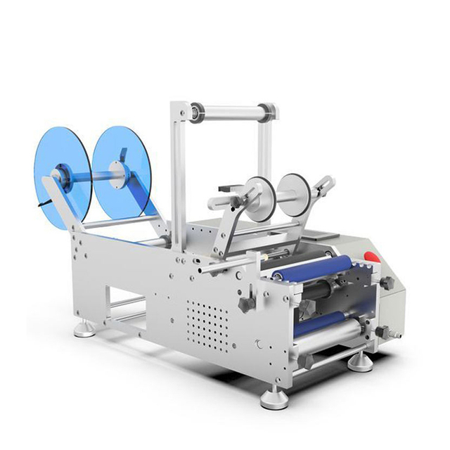 YM130 sticker labeling machine for round bottles with semi automatic operation and compact desktop structure.