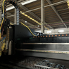 Close-up of high-precision fiber laser cutting head with autofocus function and smooth beam alignment for accurate metal sheet cutting