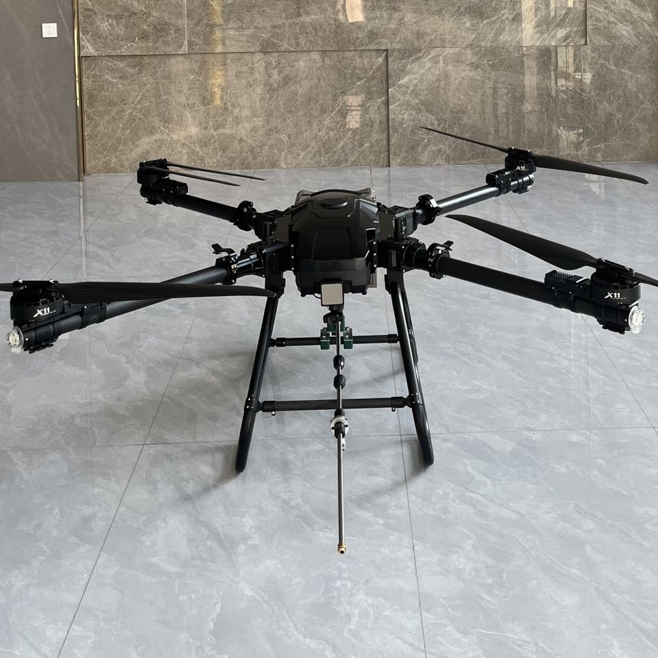 Building wash drone spraying water on tall structure