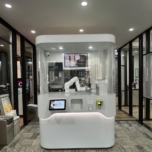 automated barista robot preparing coffee with 6 axis arm