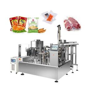Rotary vacuum packing machine for automatic filling and sealing premade pouches in food packaging applications.