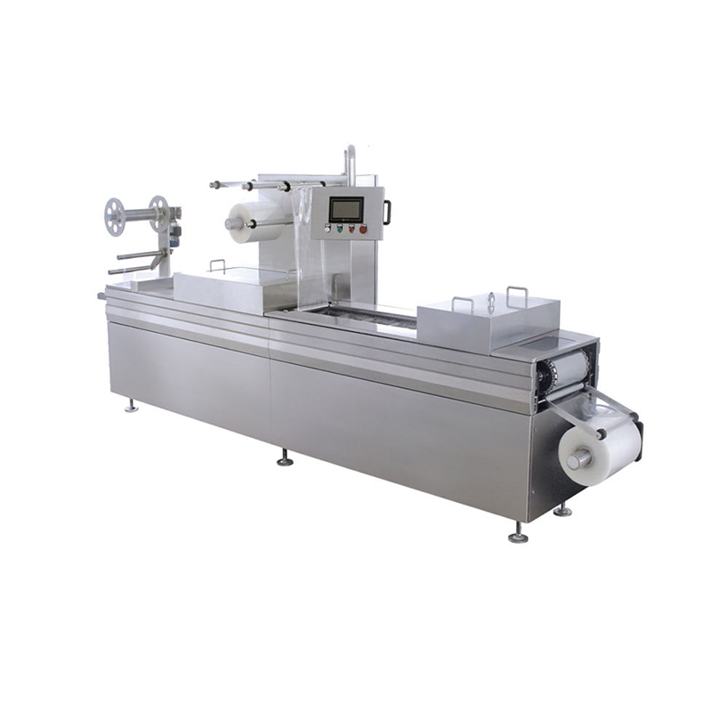 Continuous stretch vacuum packaging machine for high-speed thermoforming and automatic food sealing.
