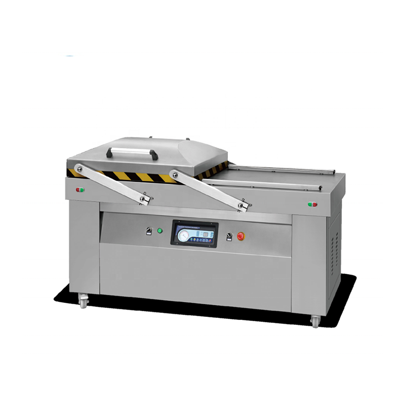Double chamber commercial vacuum packing machine with stainless steel body and automatic operation for high-volume food packaging.