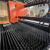 Metal parts cut by CNC fiber laser machine showing smooth edges and fine detail quality after high-speed cutting