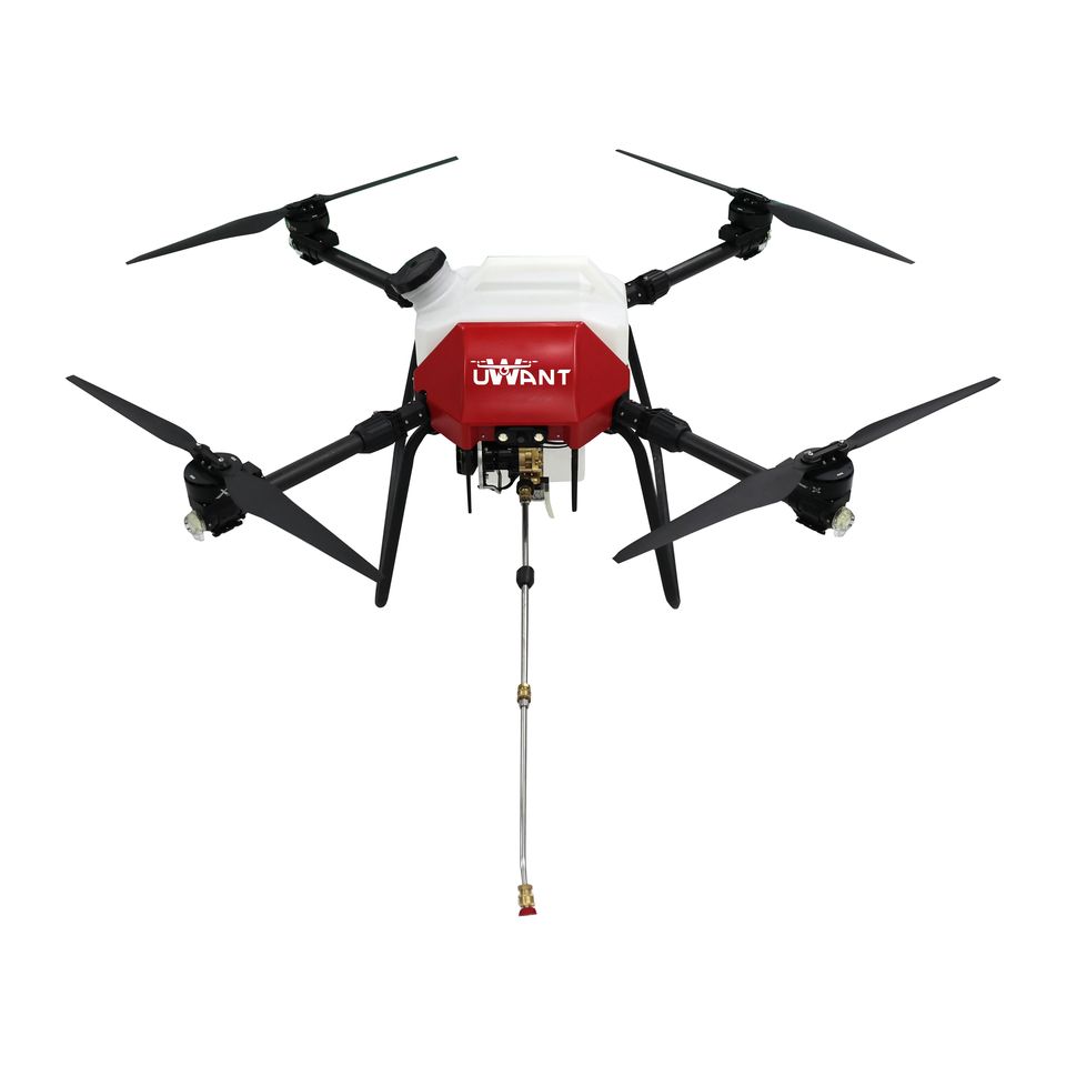 Industrial cleaning drone spraying high-pressure water on commercial building facade