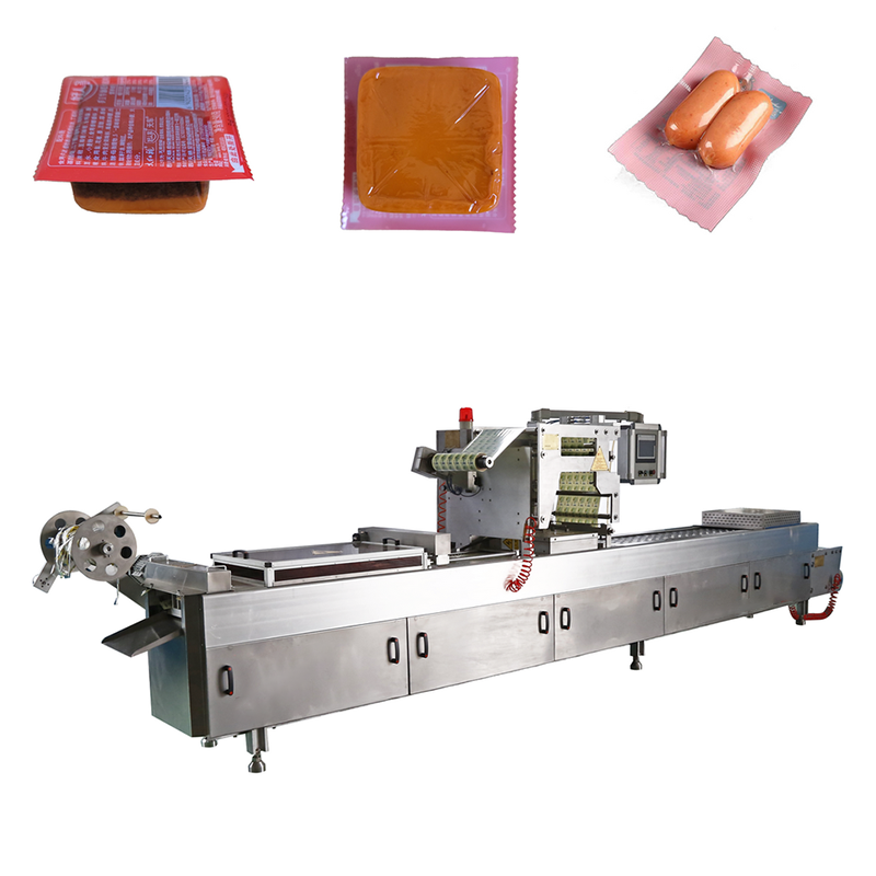 Thermoforming vacuum packaging machine for industrial food and product sealing with continuous forming and cutting.