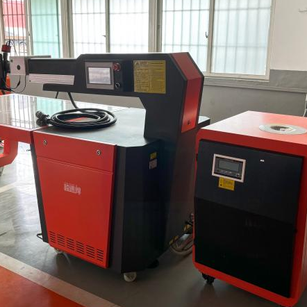 Front view of XQL-CSH portable YAG pulse laser welding machine showing touchscreen interface and compact dual-mode design for precision metal welding