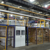 Front view of industrial nitriding furnace system with well type and hood type configurations for gear and mold heat treatment applications