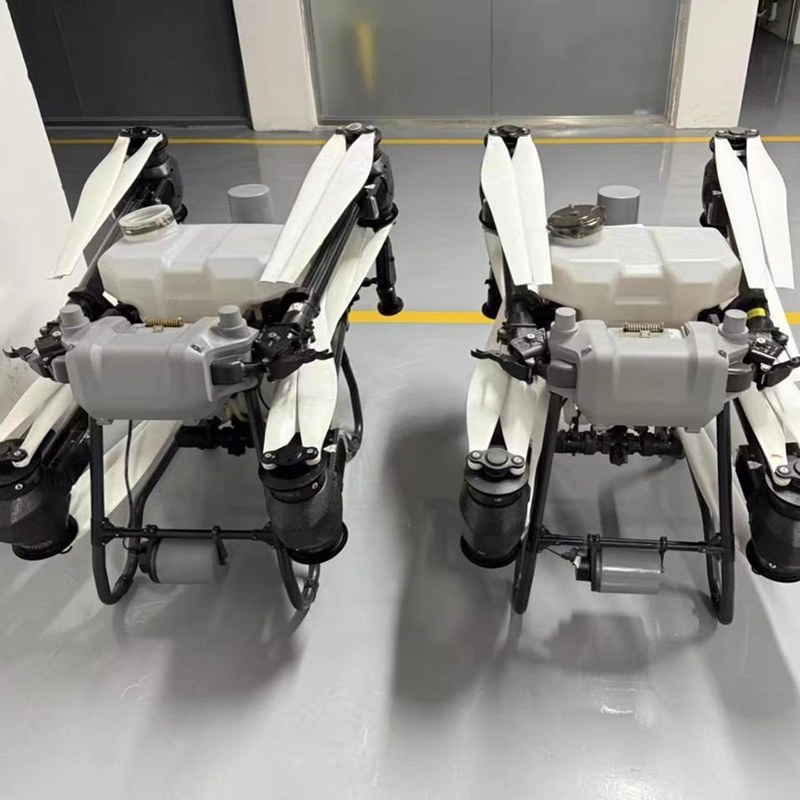 Plant protection drone operating over farmland with dual-sprayer system