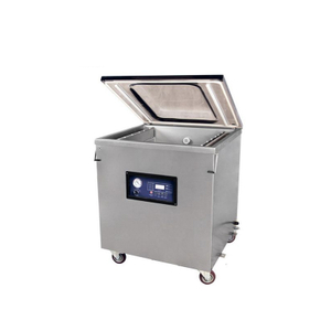 Automatic single chamber vacuum packing machine with large stainless steel structure for industrial food and commodity packaging.